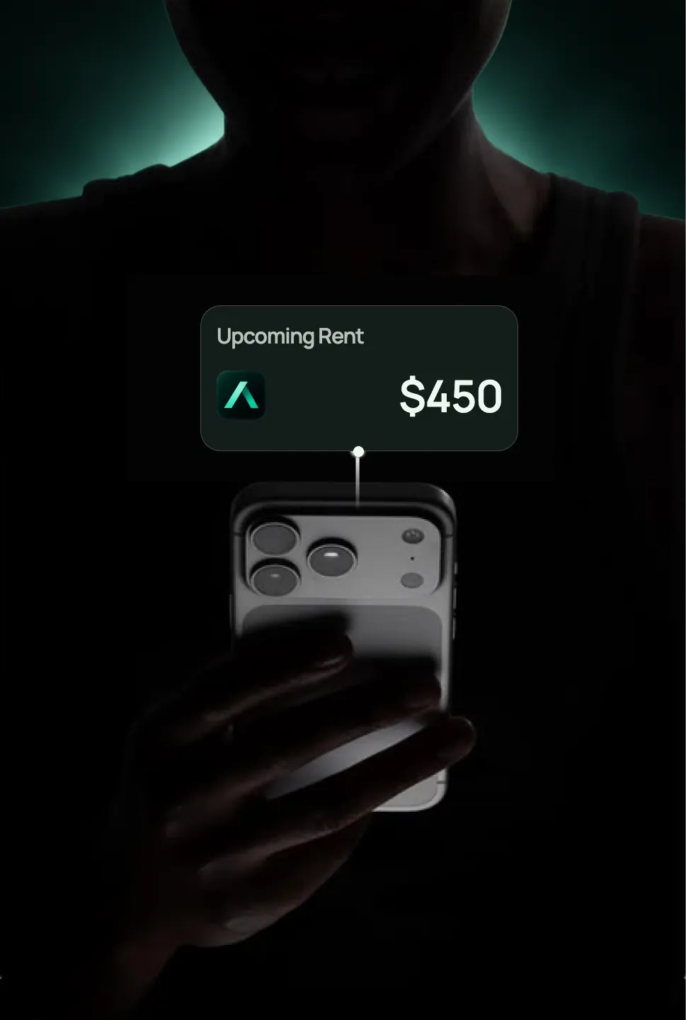A renter holding a phone with an upcoming rent payment preview.